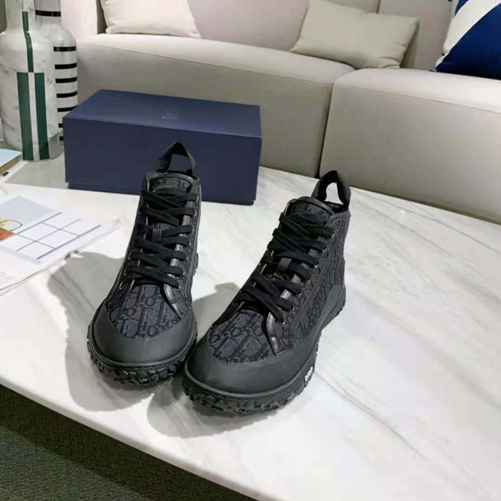 Overhead view of black rubber sole and silver hardware on Dior Unisex B28 Sneaker