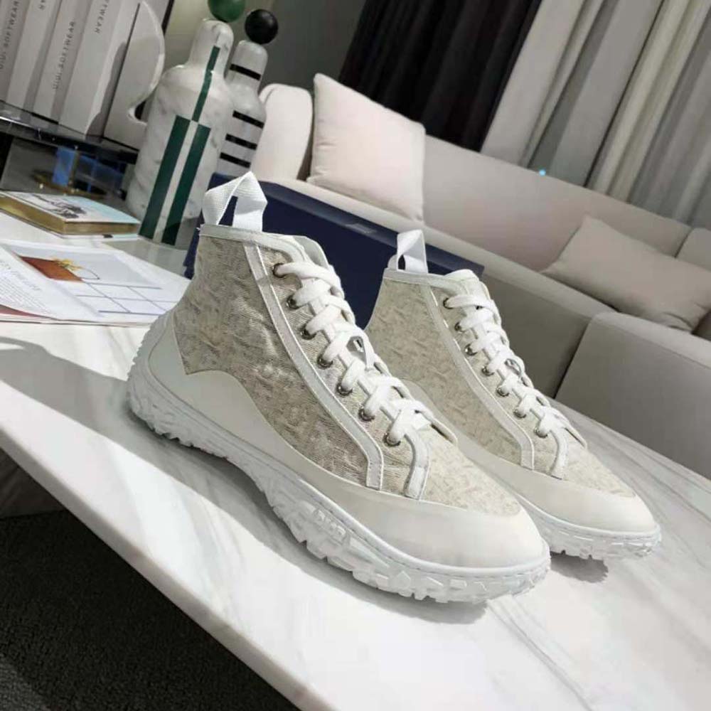 Close-up of beige Dior Oblique jacquard fabric on B28 sneaker