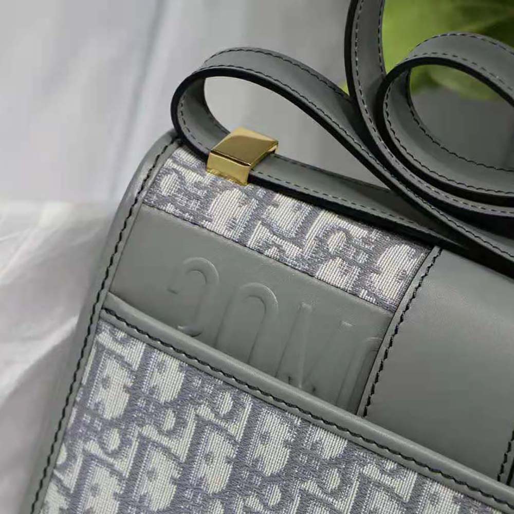 Side angle showing textile texture of Dior Women 30 Montaigne Bag Gray