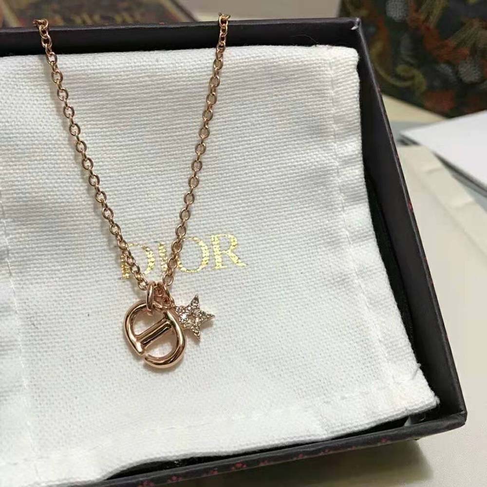 Side view of Dior Women CD Navy Necklace hanging elegantly