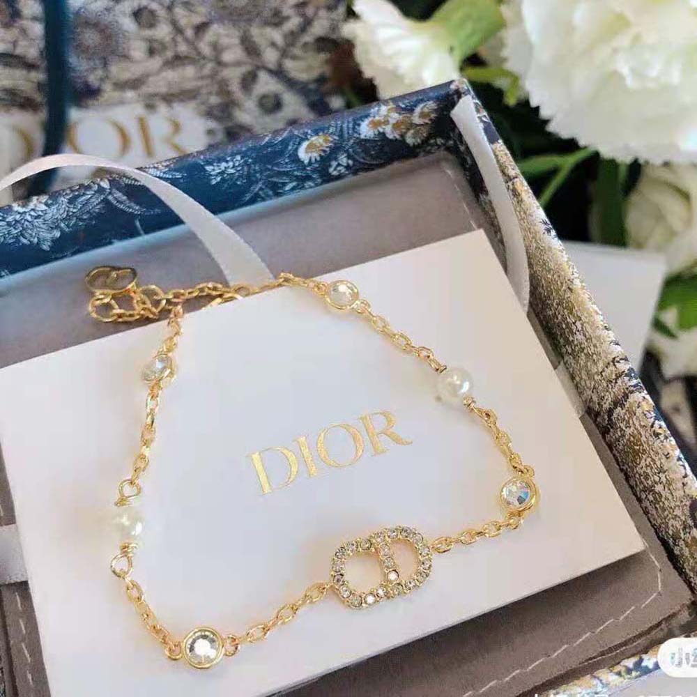 Dior Women Clair D Lune Bracelet on wrist highlighting gold finish