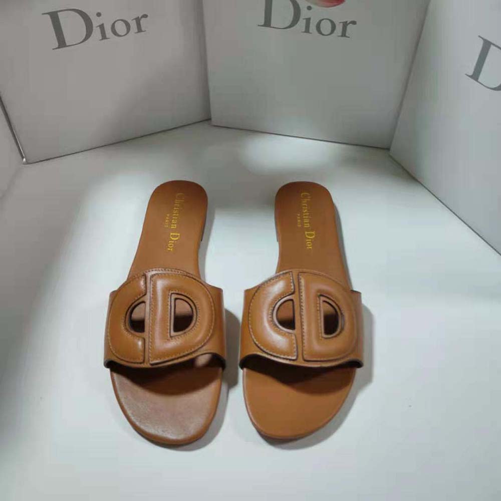 Close-up of Dior metallic signature hardware on slide strap