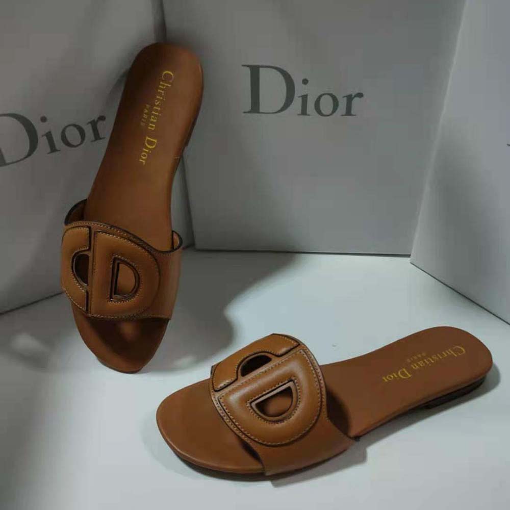 Top-down look at brown camel calfskin texture on Dior slide
