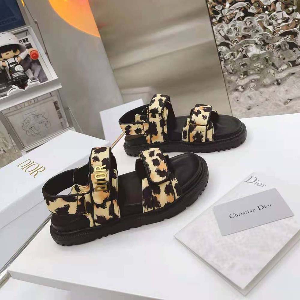 Close-up on multicolor Mizza print and Dior logo hardware on DiorAct Sandal