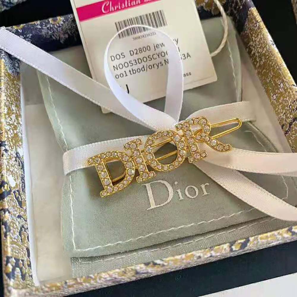 Side profile showing curved silhouette of Dior Women Dio(r)evolution Barrette Gold-Finish Metal