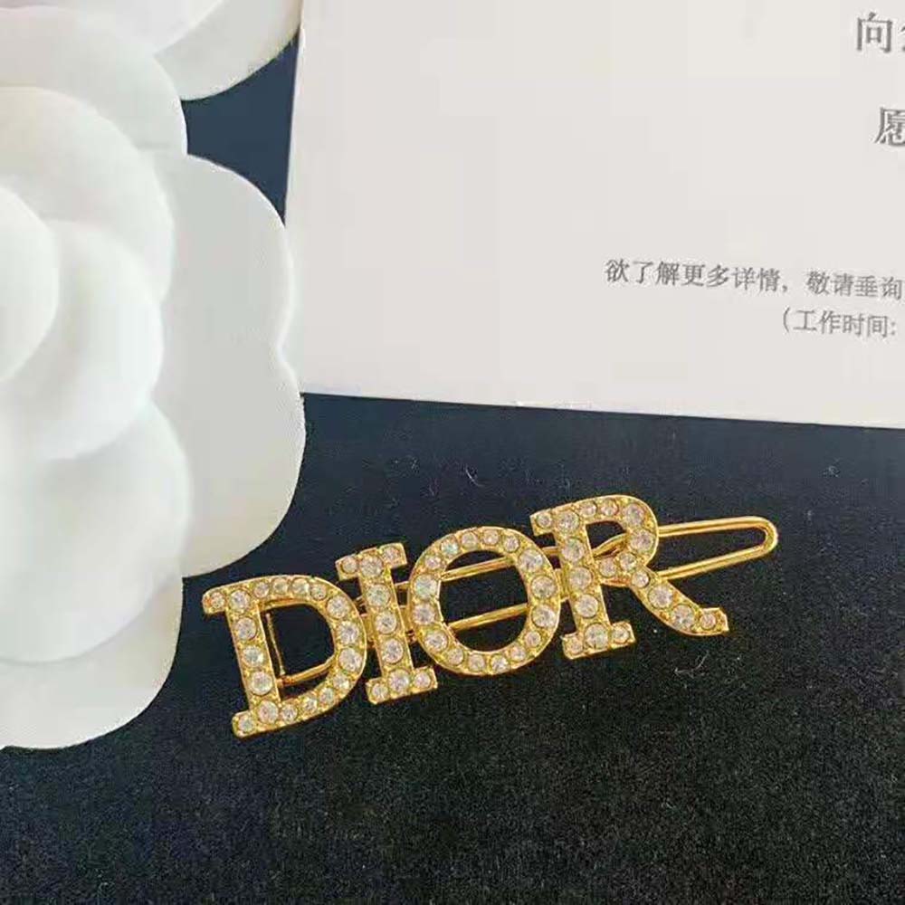 Top view highlighting polished gold finish of Dior Women Dio(r)evolution Barrette