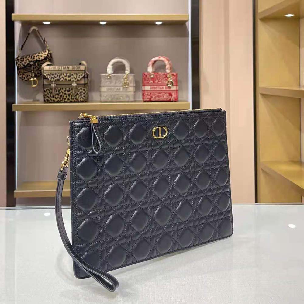 Side angle showing sleek silhouette of Dior Women Large Dior Caro Pouch