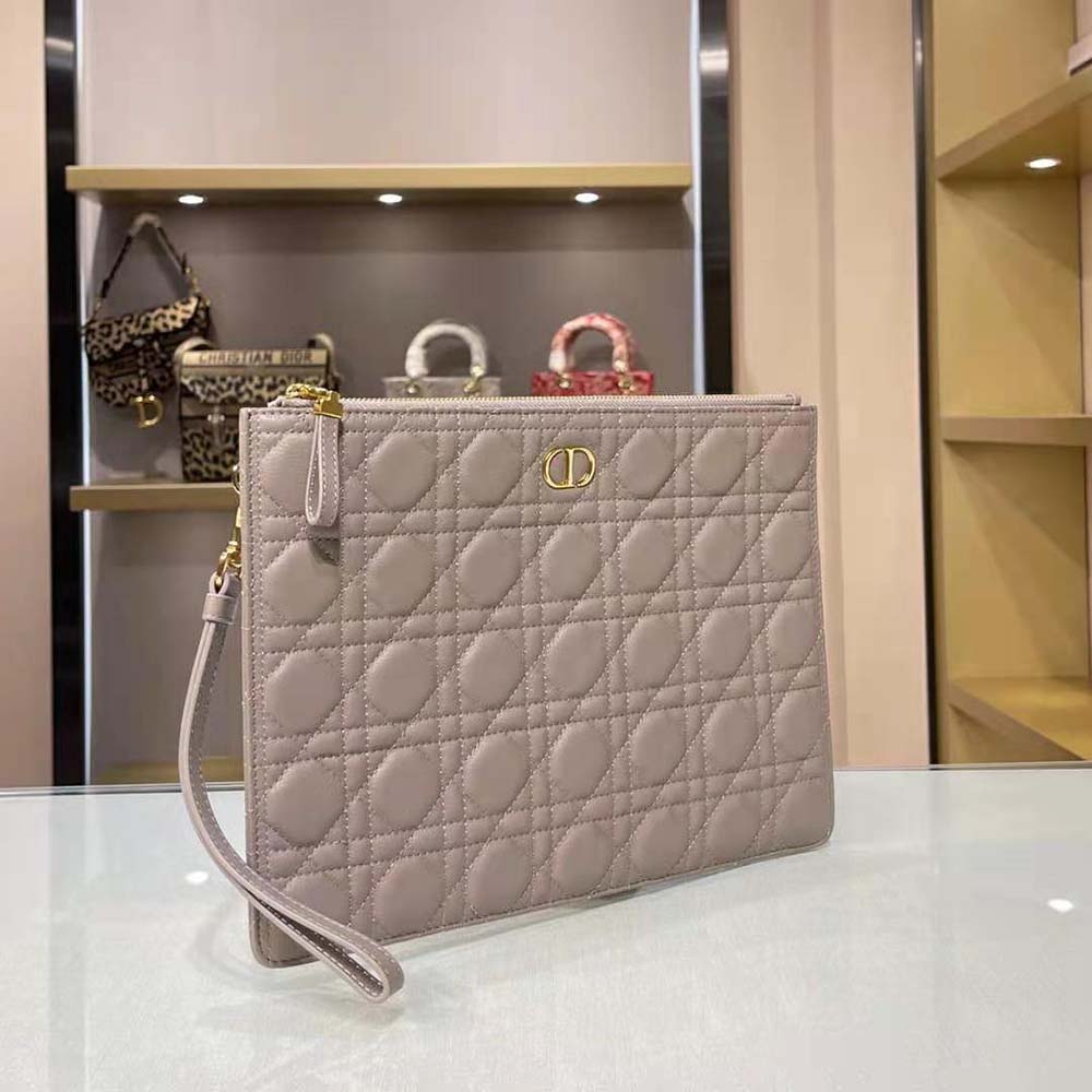 Side profile showing soft leather texture of Dior Women Large Dior Caro Daily Pouch