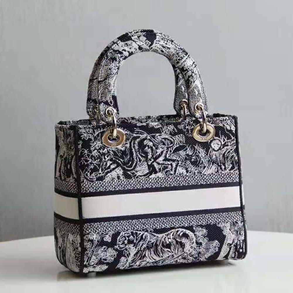Side angle showing structured silhouette of Dior Women Medium Lady D-lite Bag