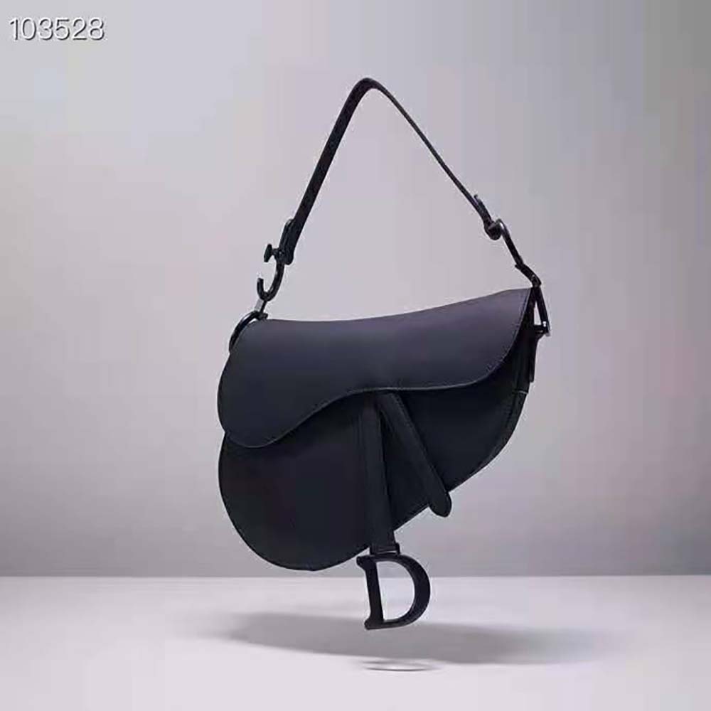 Close-up of 'CD' hardware detail on Dior Women Mini Saddle Bag Black Ultramatte Calfskin
