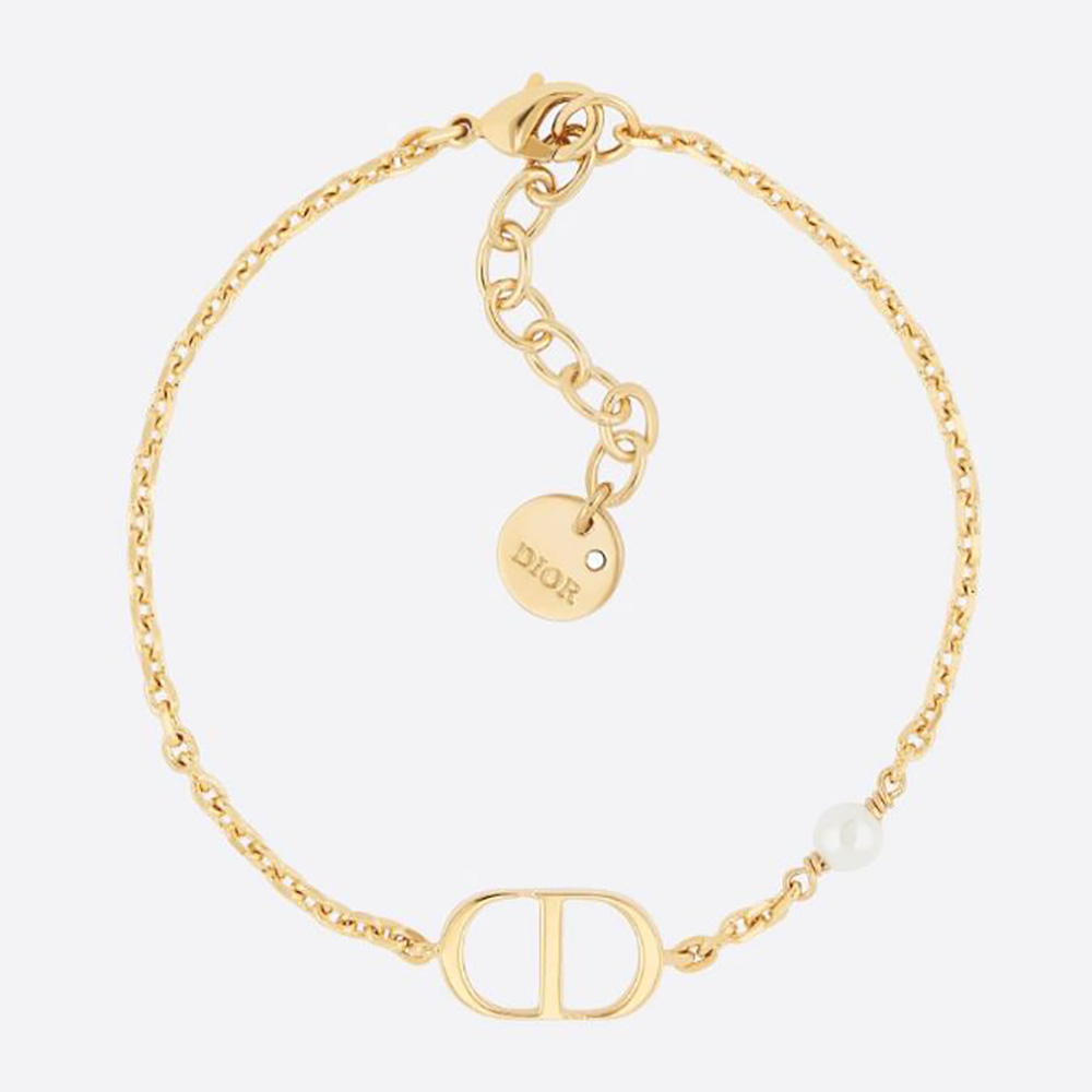 Close-up of Dior Women Petit CD Bracelet gold-finish metal and pearl