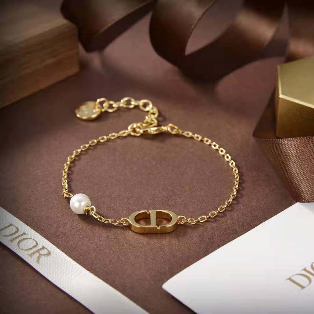 Wrist shot of Dior Women Petit CD Bracelet shining in natural light