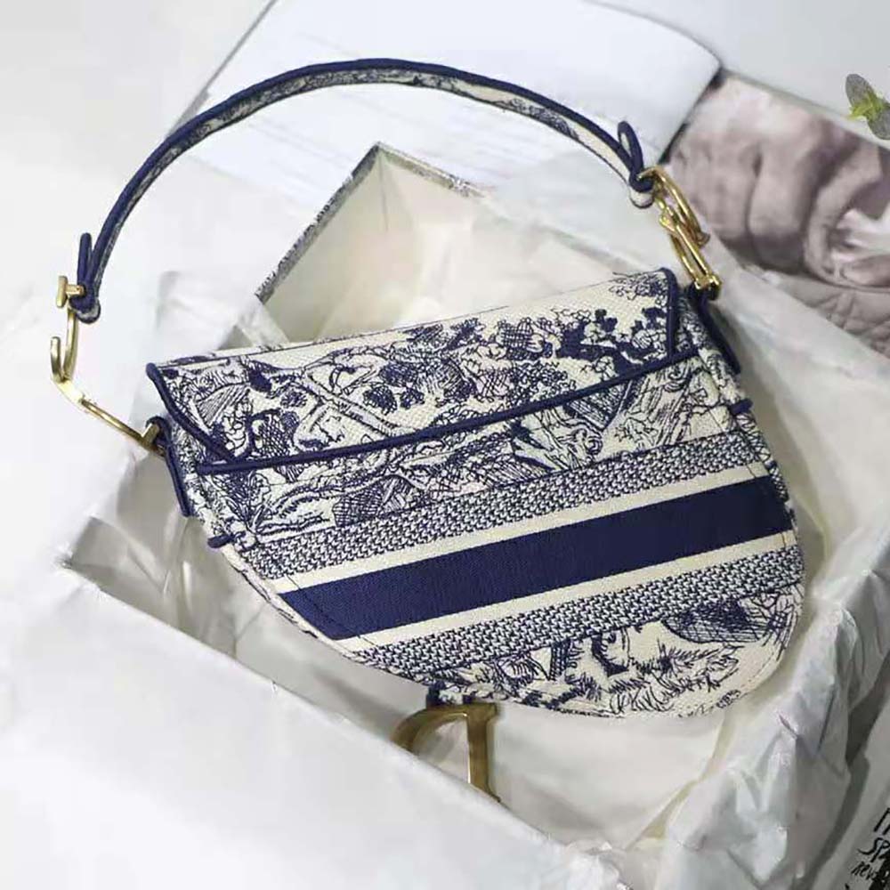 Side angle of Dior Women Saddle Bag Blue Toile de Jouy Embroidery with strap