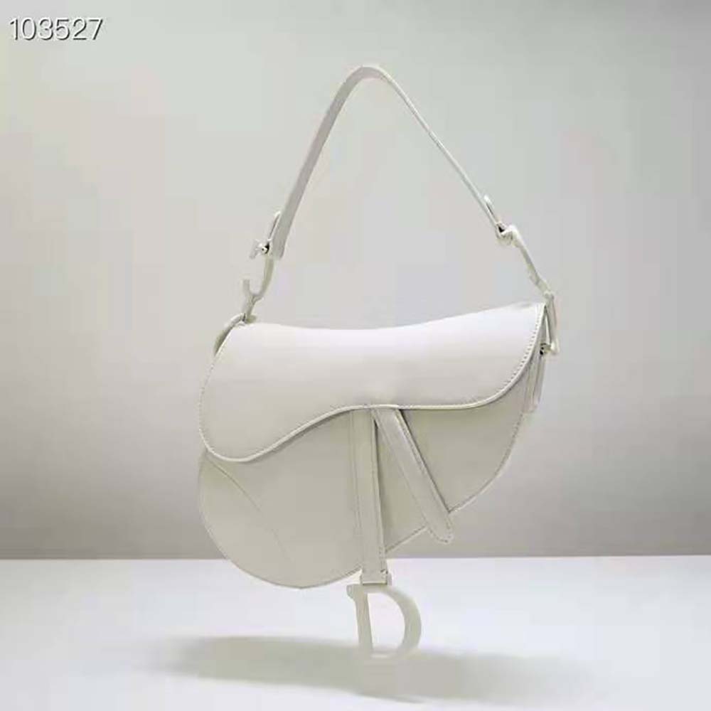 Close-up of gold ‘D’ hardware on Dior Women Saddle Bag Latte Ultramatte Calfskin