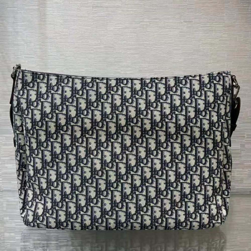 Side angle showing curved silhouette of Dior Women Saddle Soft Bag