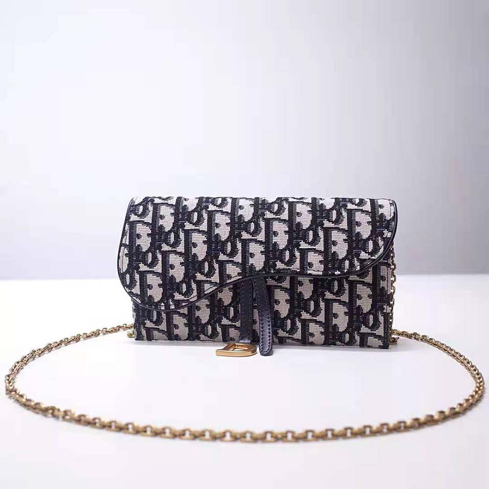Close-up of silver hardware on Dior Women Saddle Wallet Blue Dior Oblique Jacquard