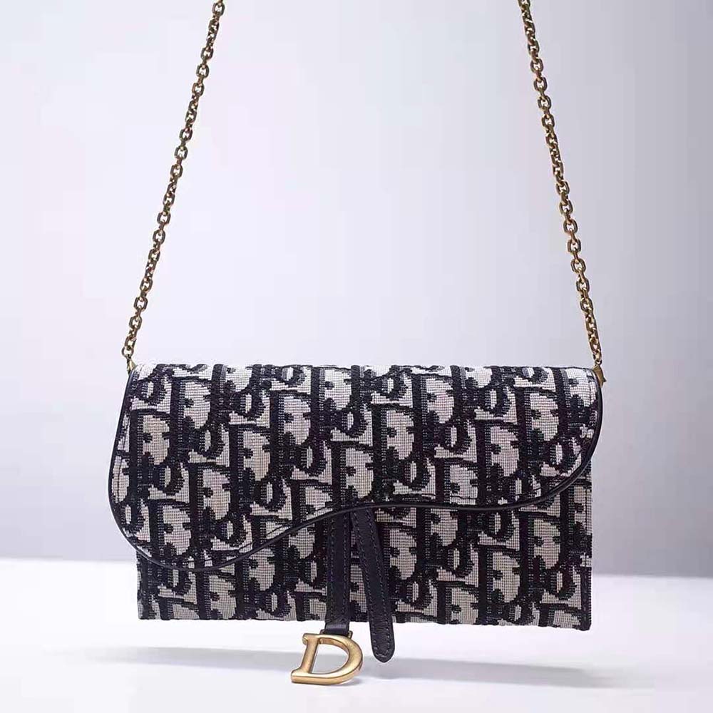 Side angle showing adjustable strap of Dior Women Saddle Wallet Blue Dior Oblique Jacquard