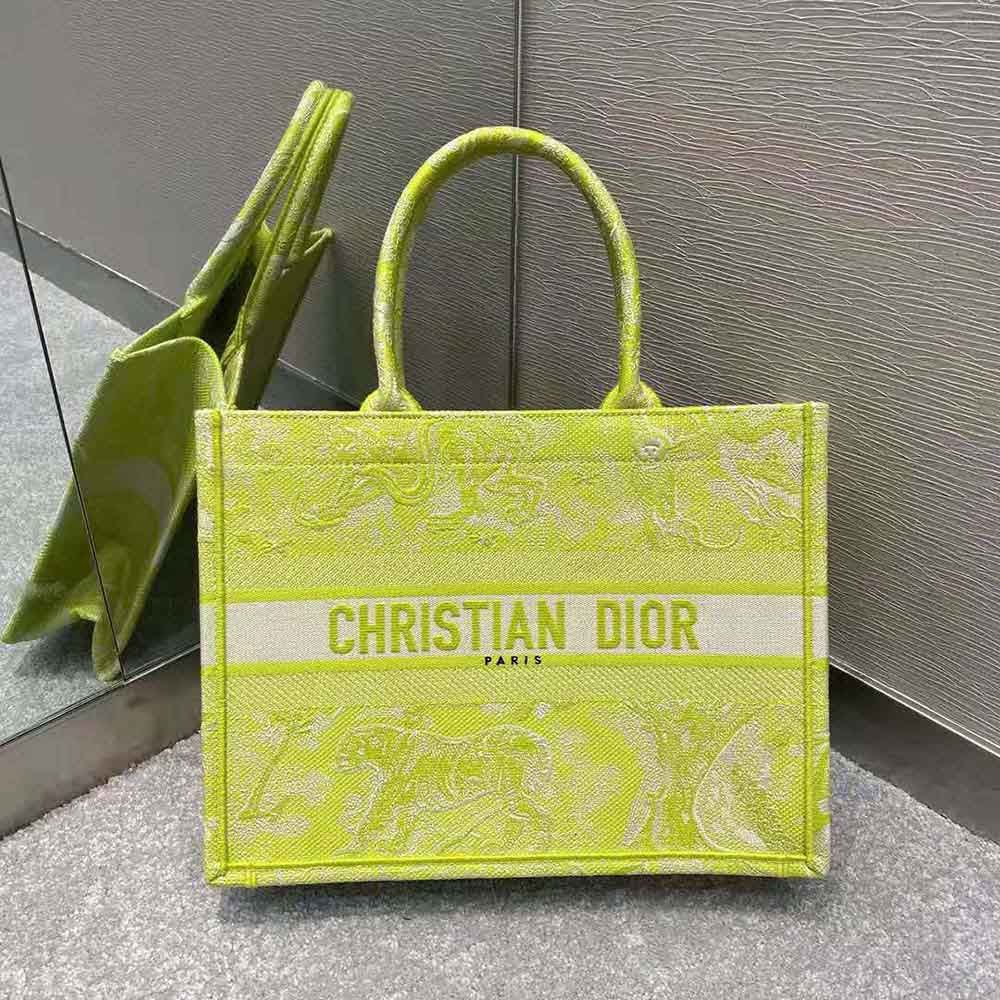 Close-up of lime green reverse embroidery detail on Small Dior Book Tote
