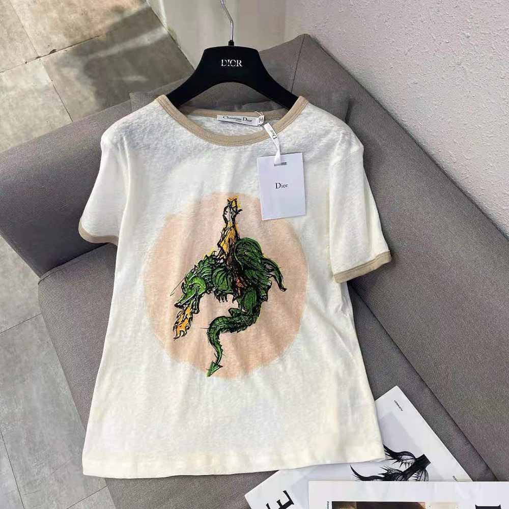 Close-up of embroidered Princess and Dragon detail on Dior t-shirt