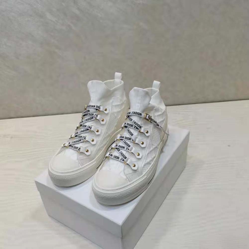 Top view showing white laces and mesh material on Dior sneaker