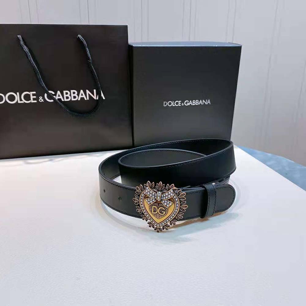 Close-up of gold Devotion logo buckle on Dolce Gabbana belt