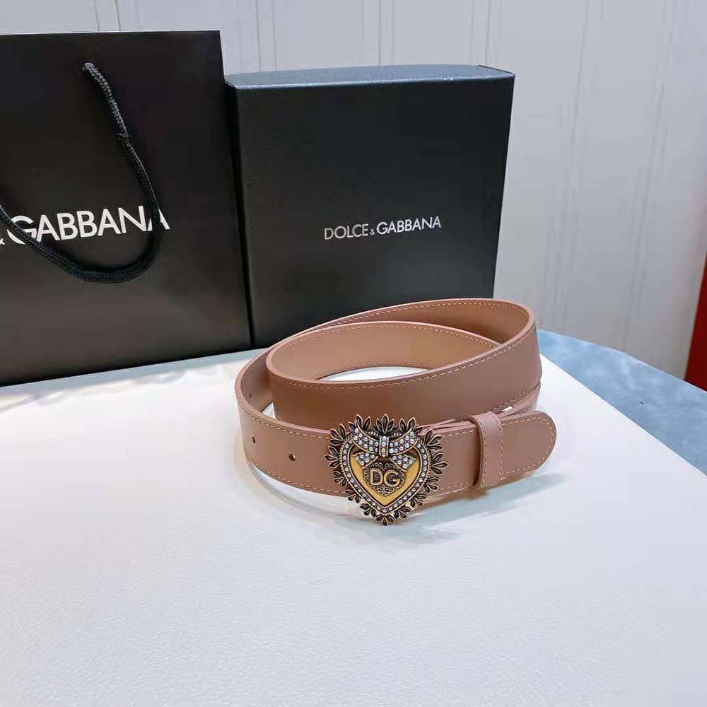Close-up of gold-tone D&G buckle on pink leather belt