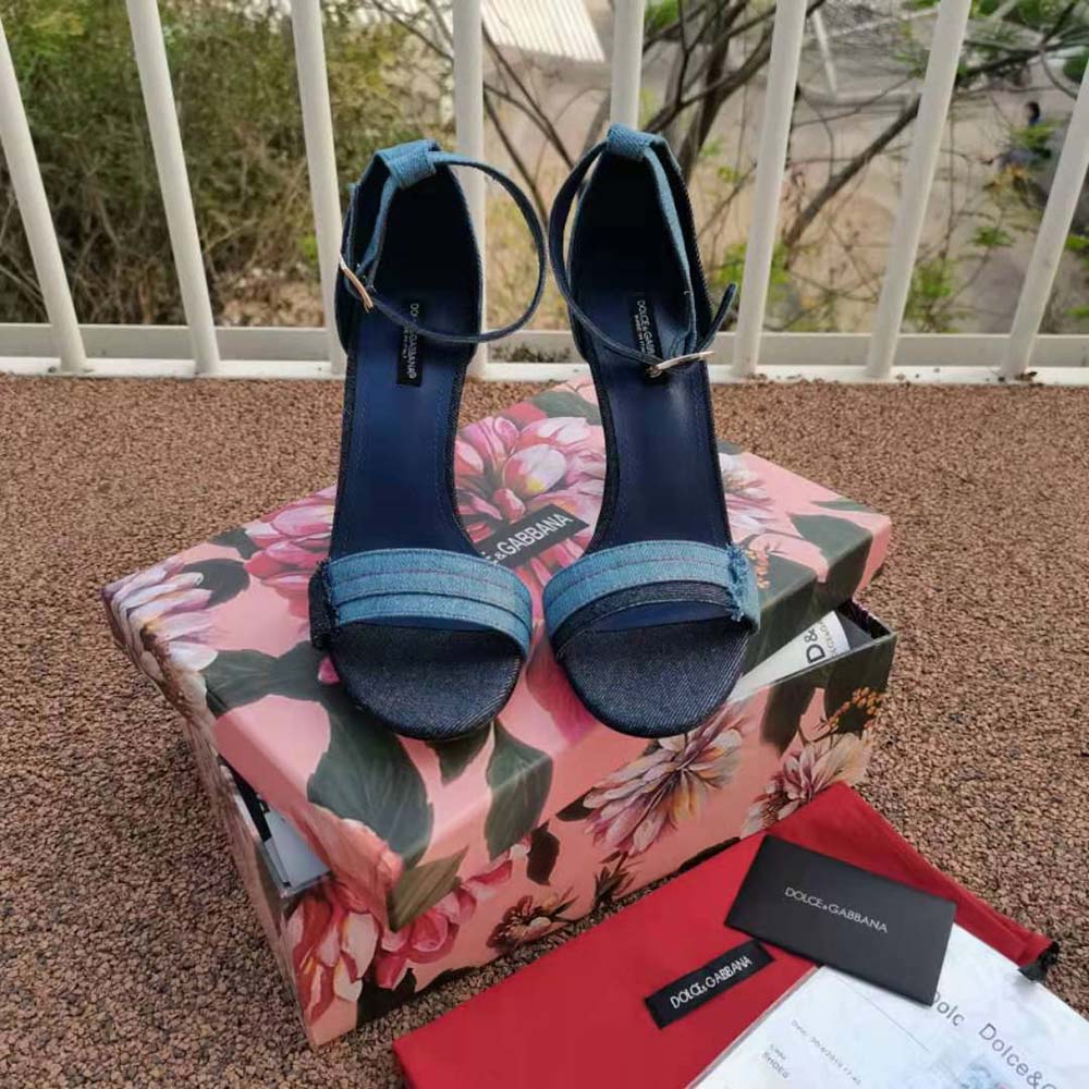 Close-up on blue patchwork denim and gold baroque DG heel detail