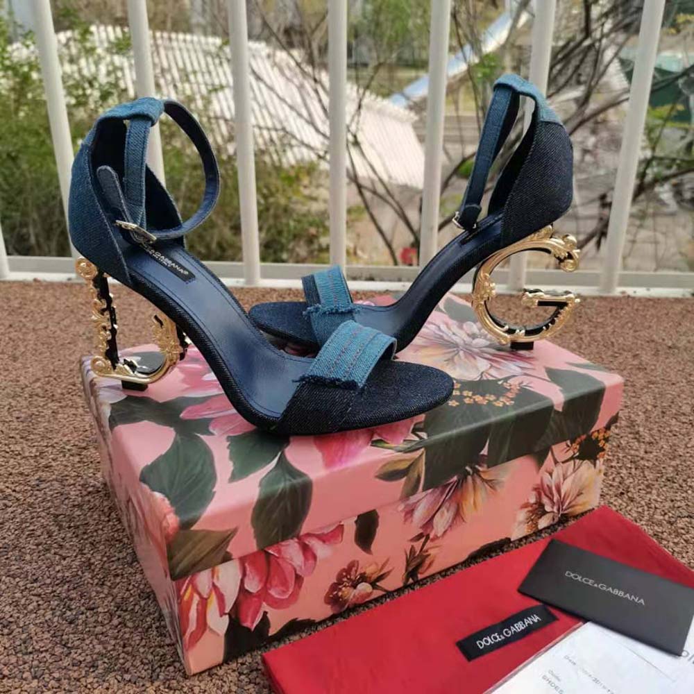 Top-angle showing adjustable buckle and open-toe design of Dolce Gabbana sandals