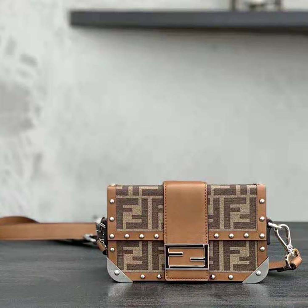 Close-up of gold-tone hardware on Fendi Men Baguette Trunk Mini Brown Fabric Bag