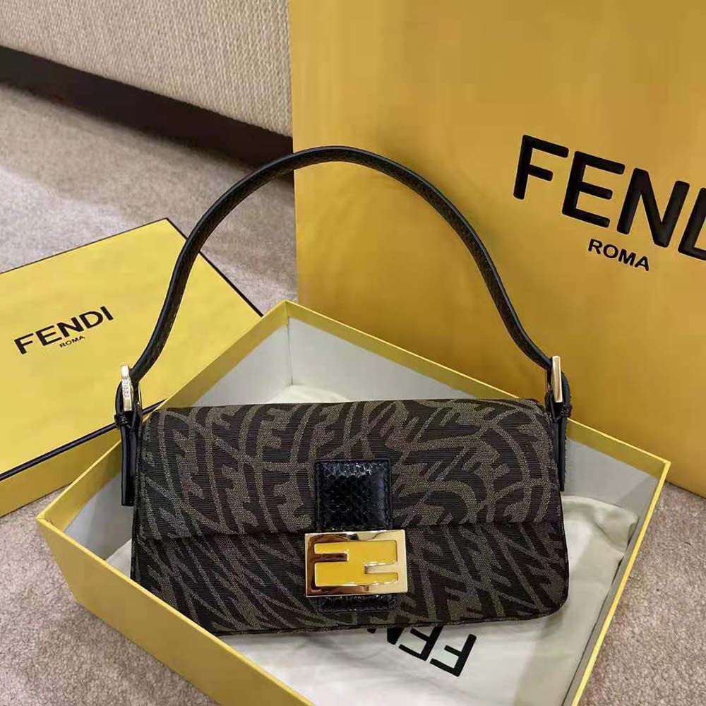 Close-up of gold-tone Vertigo hardware on Fendi Women Baguette 1997