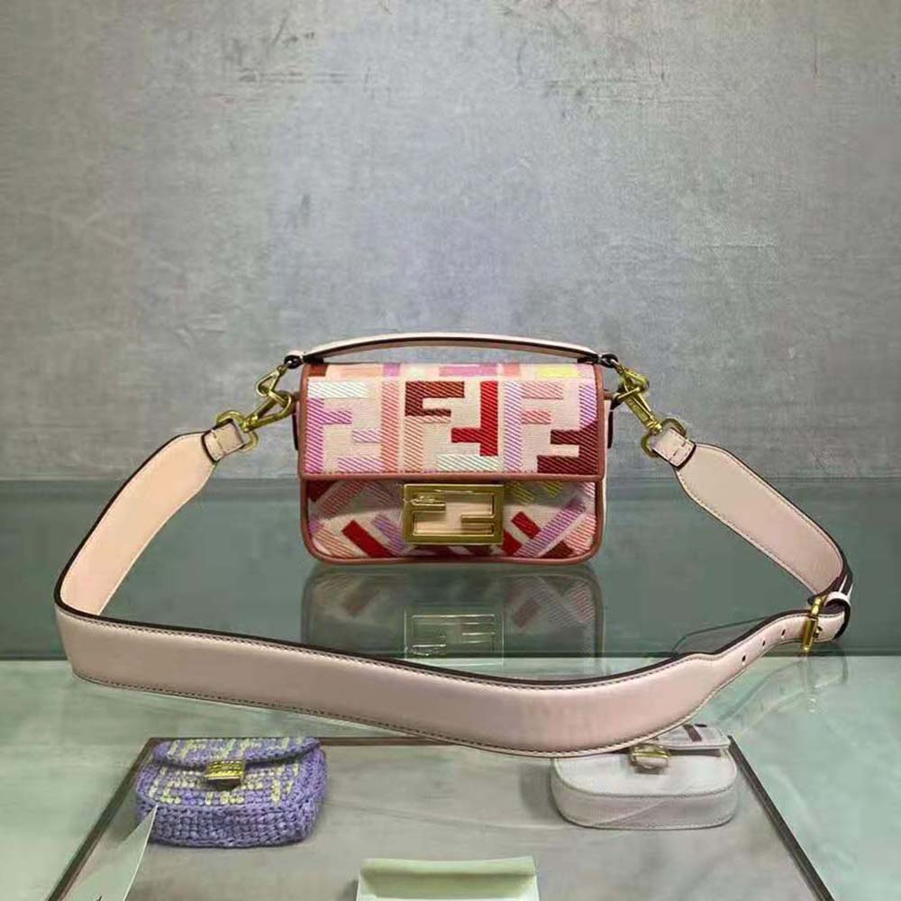 Close-up of Fendi Women Baguette Bag signature FF logo and magnetic flap