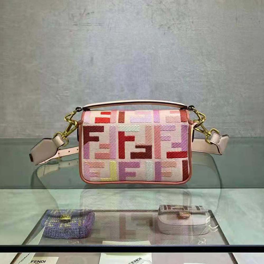 Side angle showing silhouette and shoulder strap of Fendi Women Baguette Bag