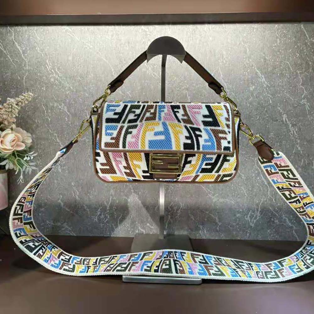 Close-up of embroidery and gold hardware on Fendi Women Baguette Bag