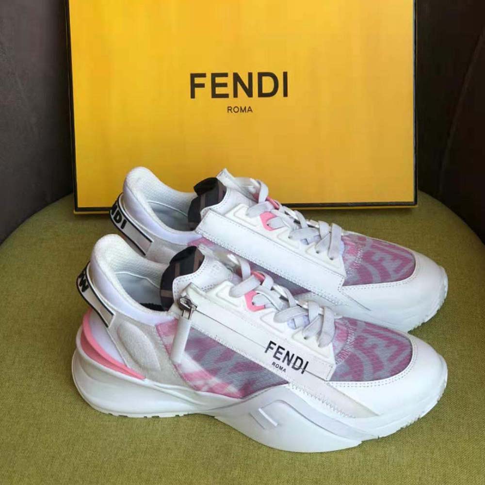 Close-up of signature Fendi logo hardware on pink nylon low tops