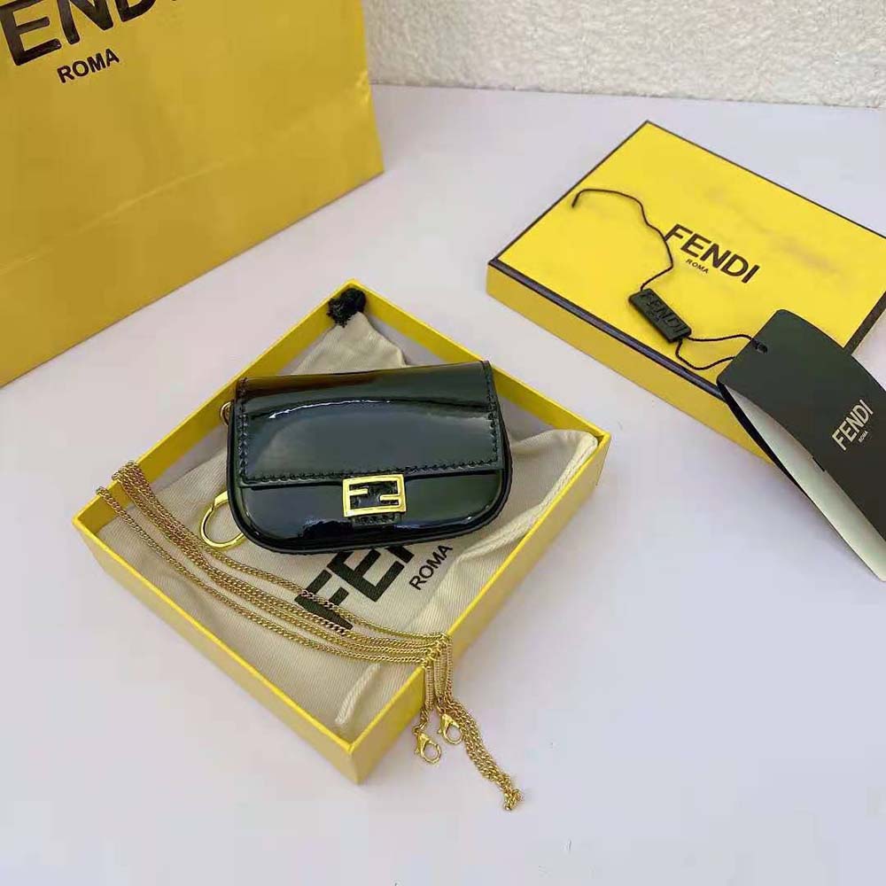Close-up of gold-tone hardware and signature charm on Fendi bag