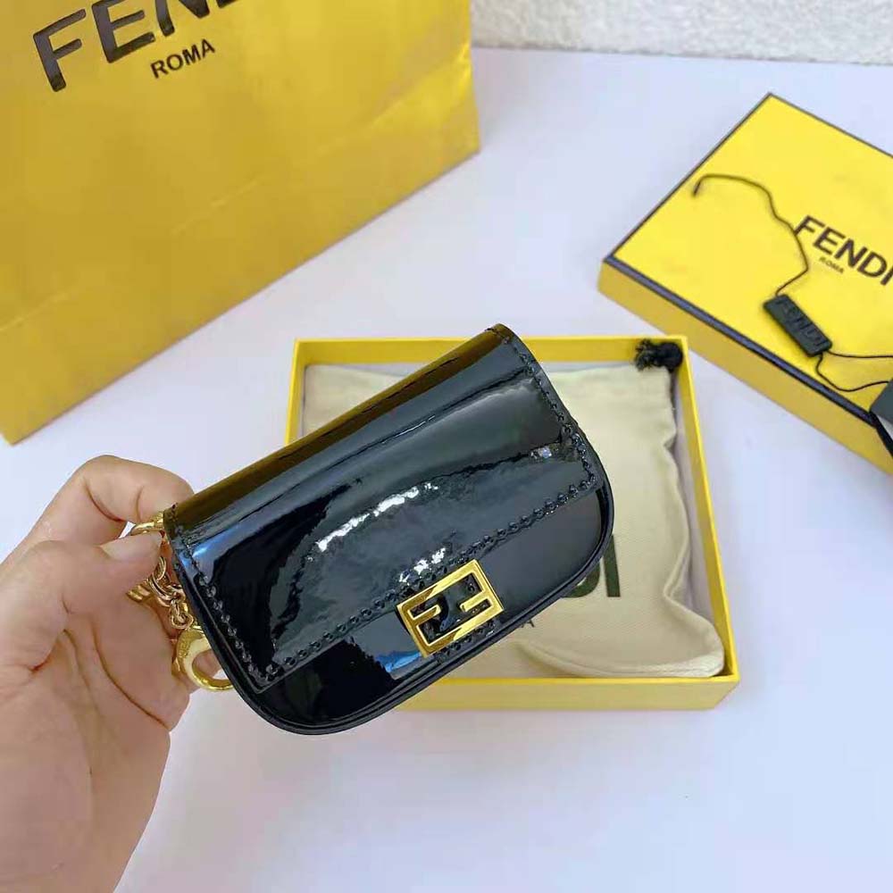 Side angle showing compact silhouette of Fendi Women Nano Baguette bag