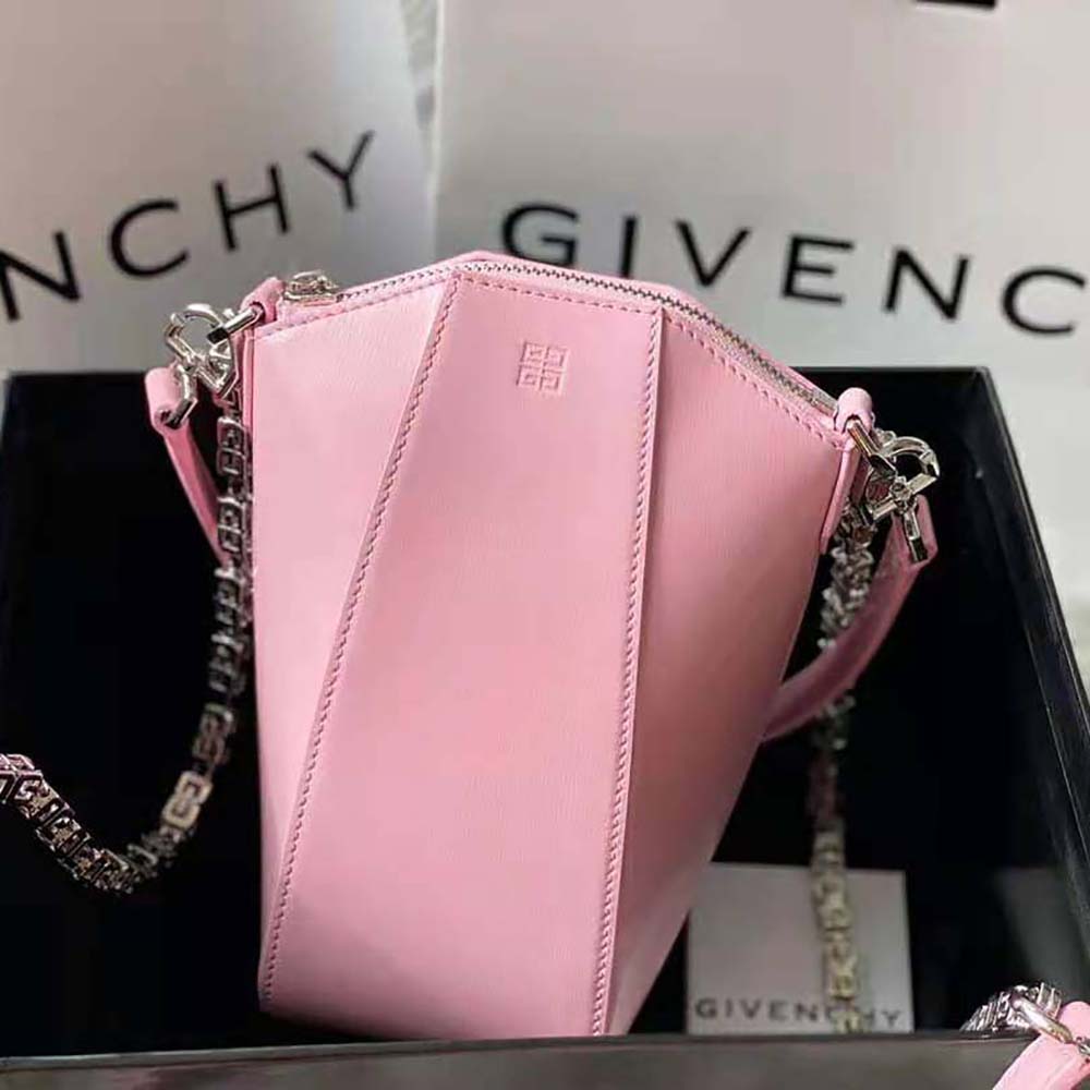 Side angle showing slim profile of Givenchy Women Mini Antigona Vertical Bag in pink