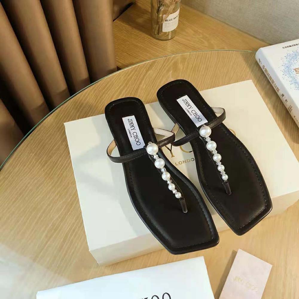 Close-up of pearl embellishments on Jimmy Choo Alaina Flat Black Nappa Leather Flats