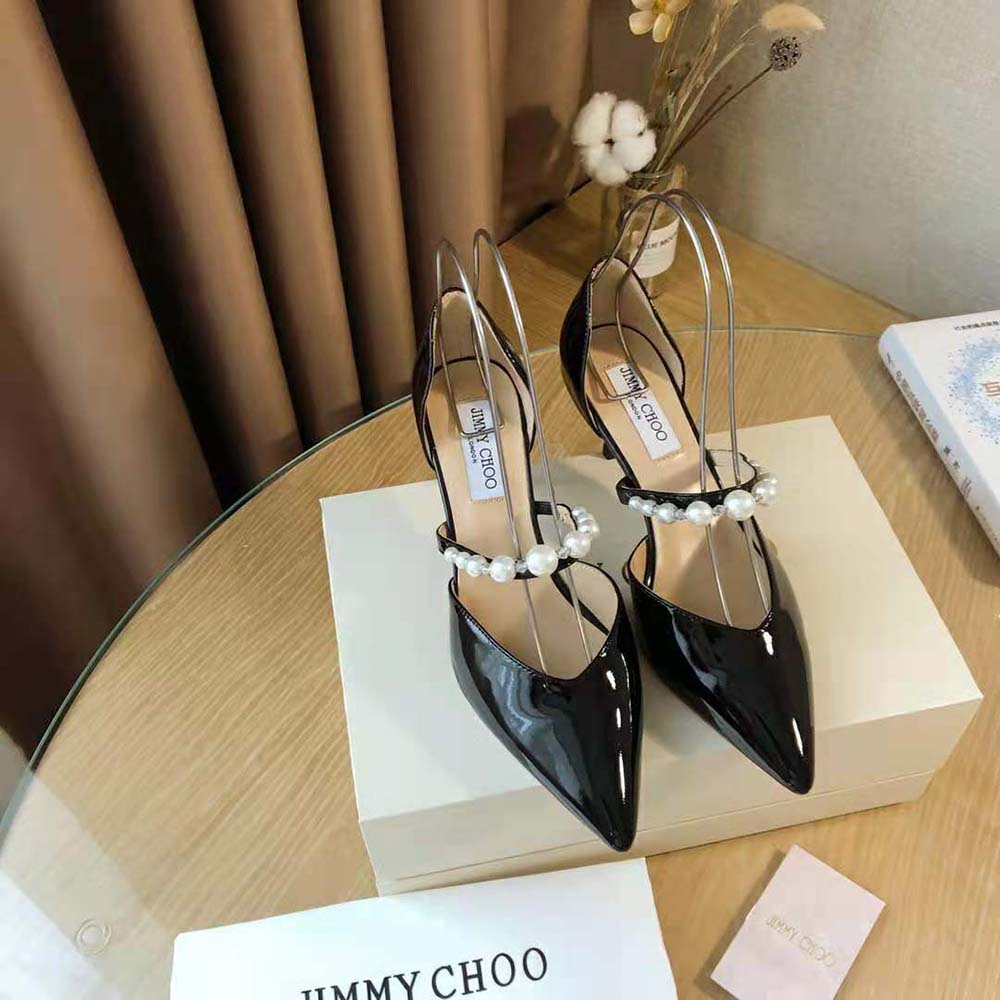 Close-up of pearl embellishment on Jimmy Choo Women Aurelie 85 Black Patent Leather Pumps
