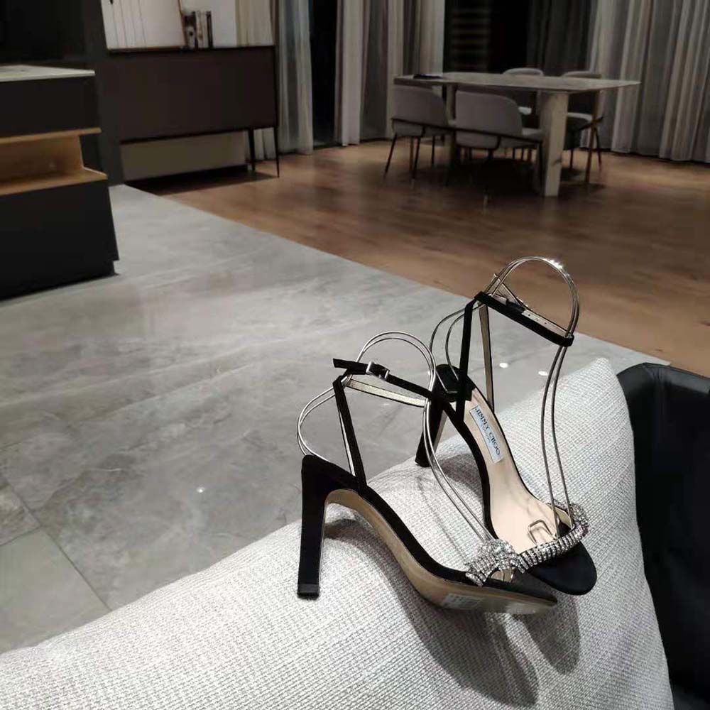 Rear angle showing stiletto heel of Jimmy Choo Women Thyra 100 Black Suede Sandals