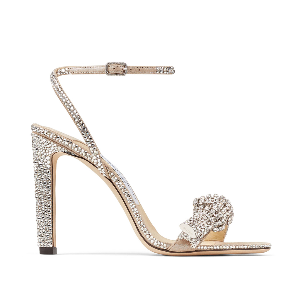 Side angle of Jimmy Choo Women Thyra 100 Nude Suede Sandals showing heel
