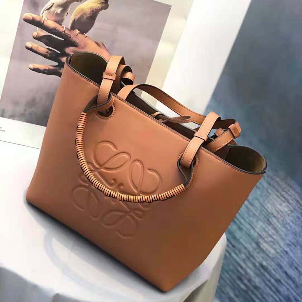 Side angle showing structured silhouette of Loewe Women Small Anagram Tote