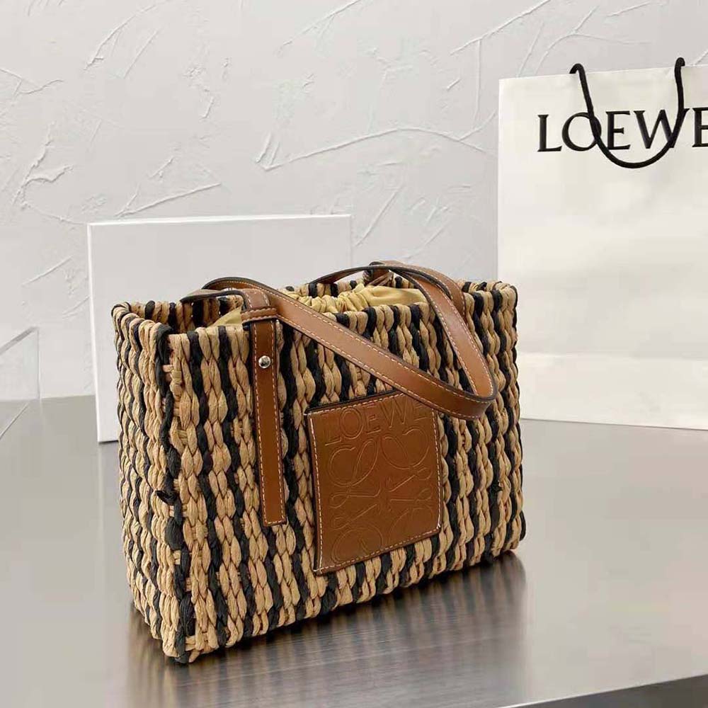 Side angle showing compact silhouette of Loewe Small Square Basket Bag