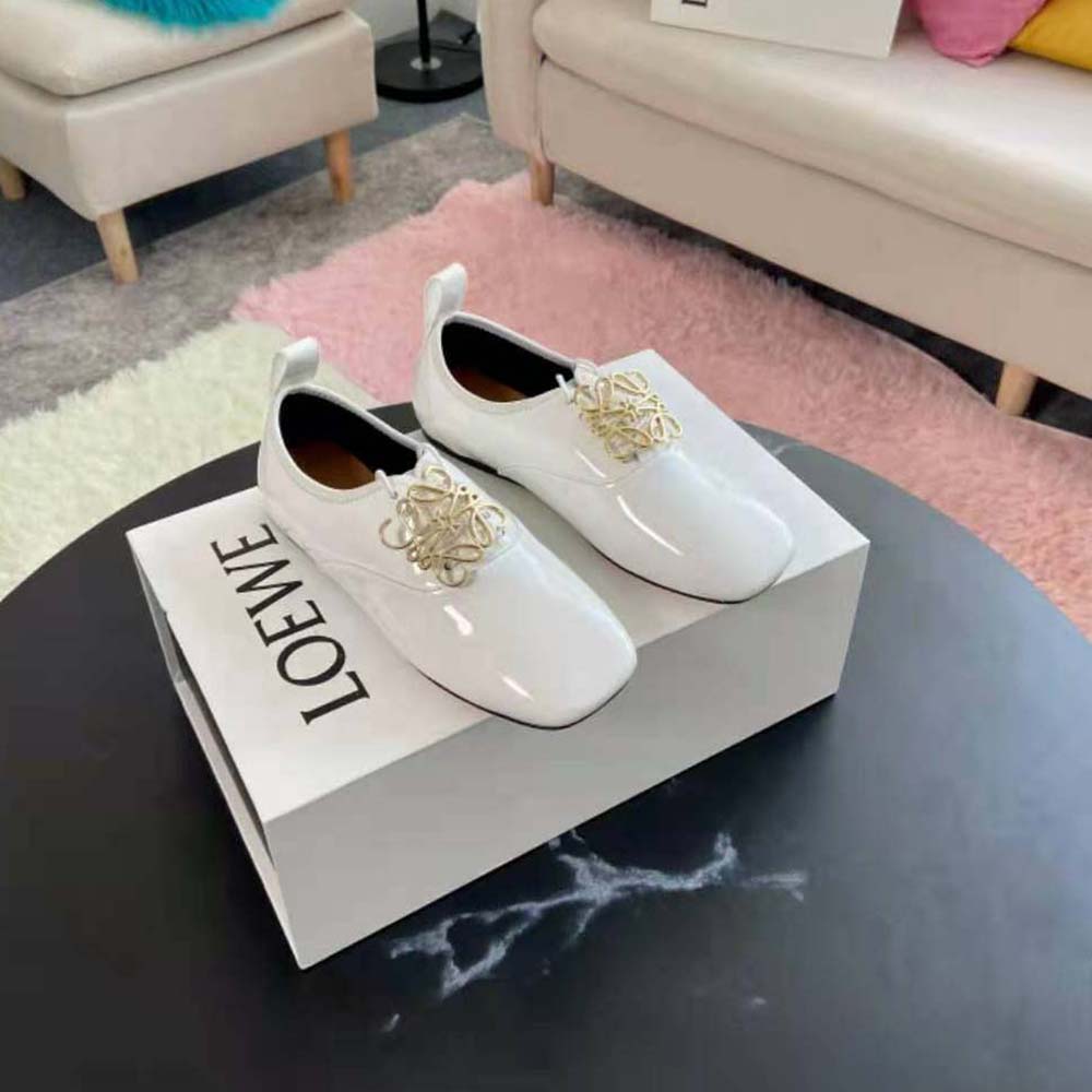 Close-up of glossy patent leather and Anagram detail on Loewe shoe
