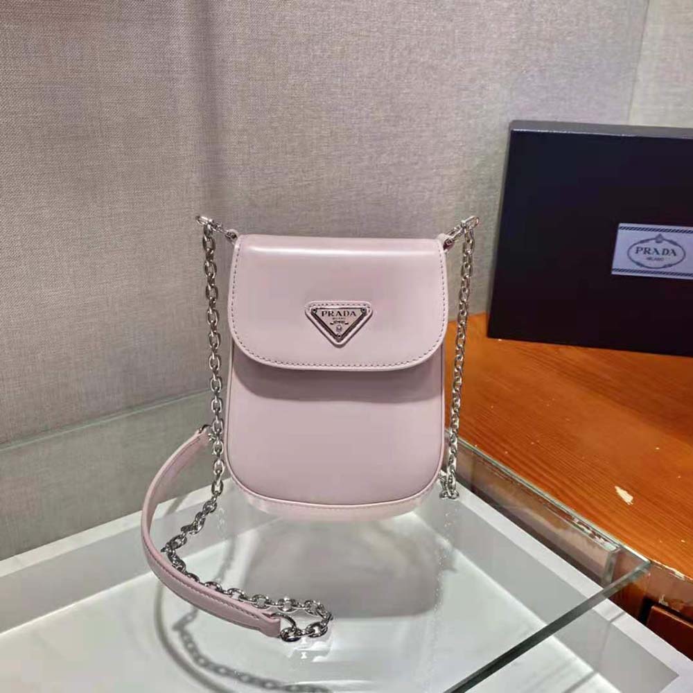 Side angle showing compact silhouette of Prada Women Brushed Leather Mini-Bag-Pink