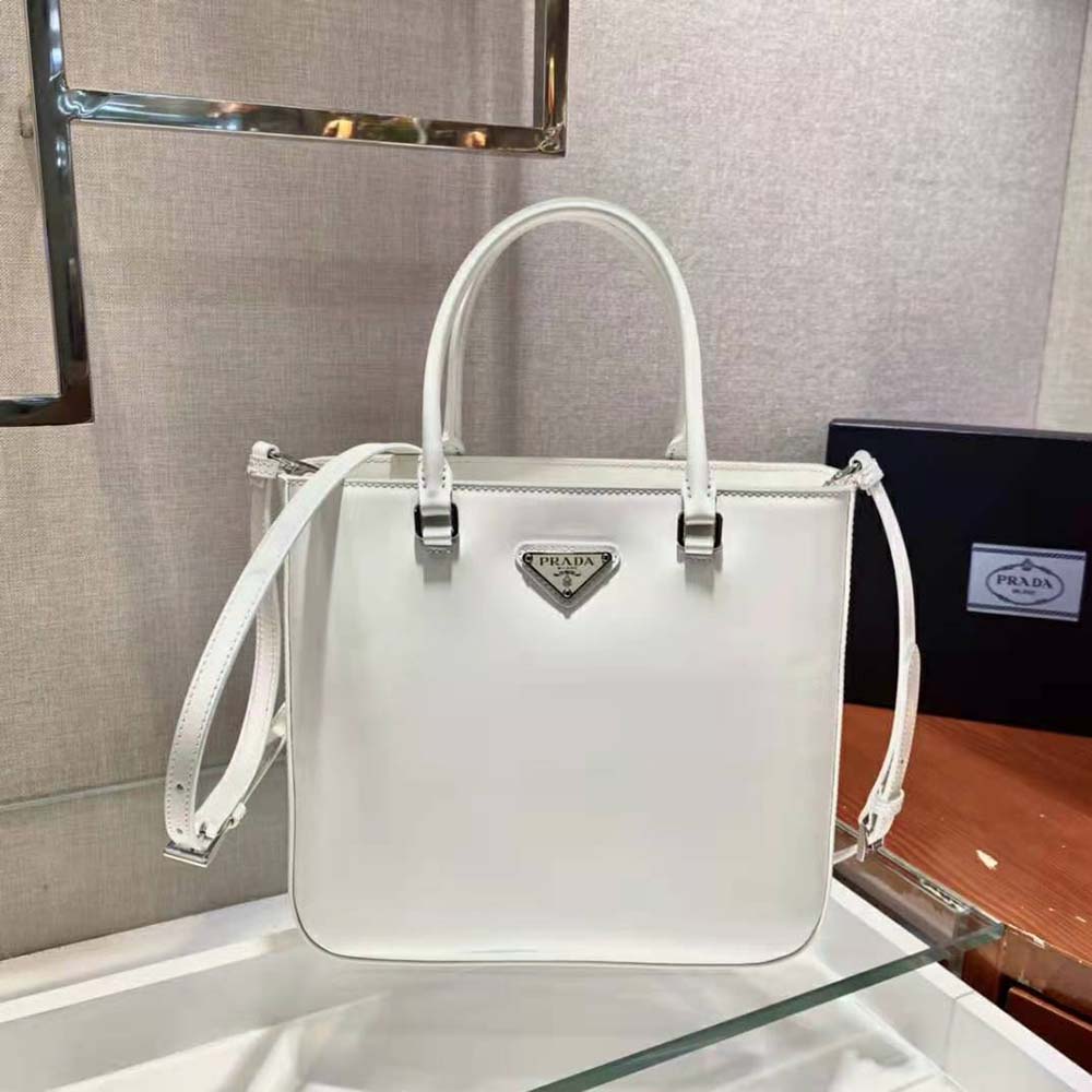 Close-up of brushed leather texture and silver hardware on Prada Women Tote