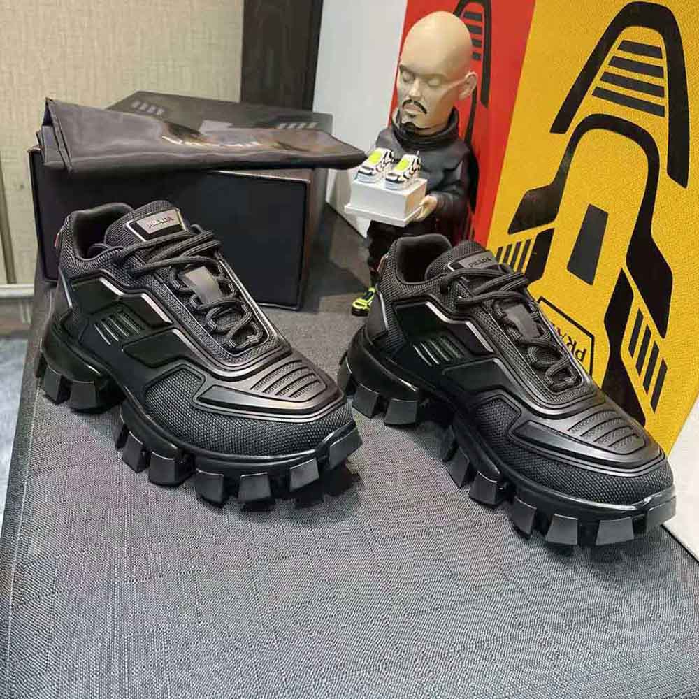 Close-up of lace-up closure and textured black mesh on Prada Cloudbust Thunder Sneakers