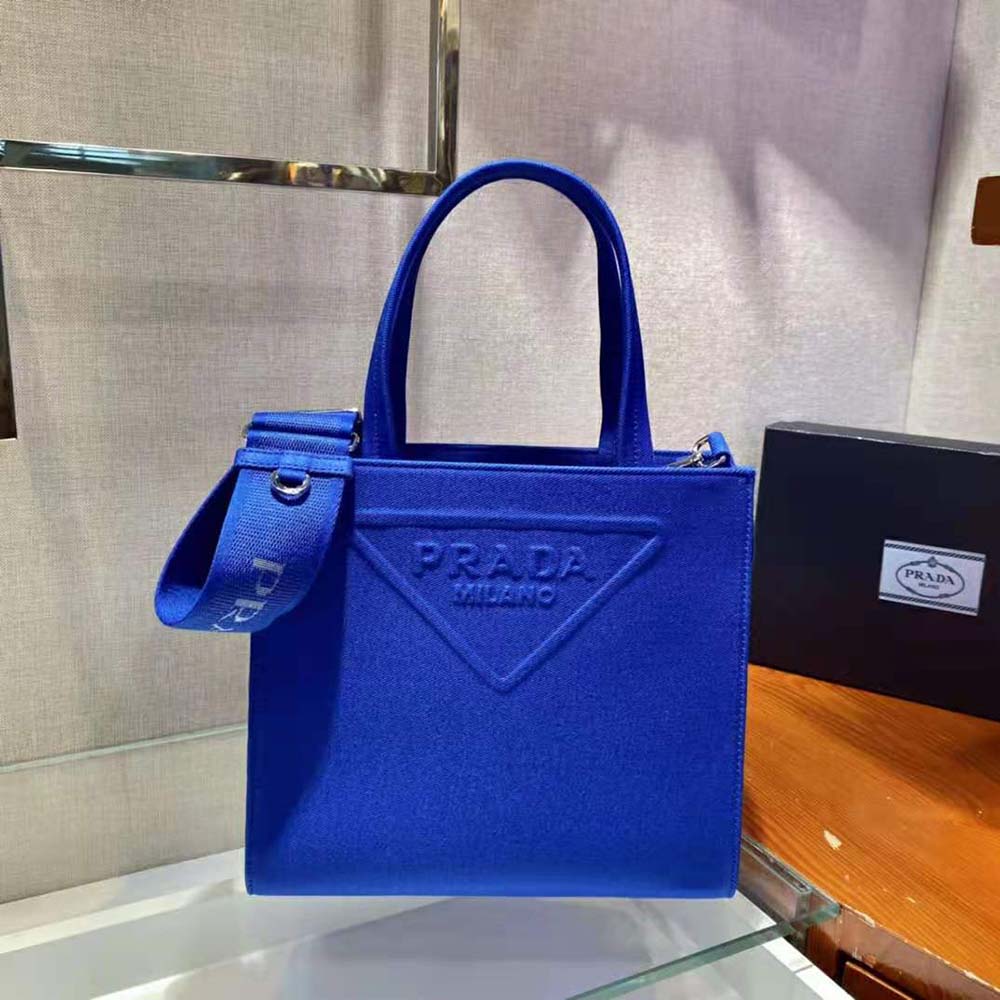 Close-up of silver-tone hardware on Prada Women Drill Tote Handles Bag-Blue