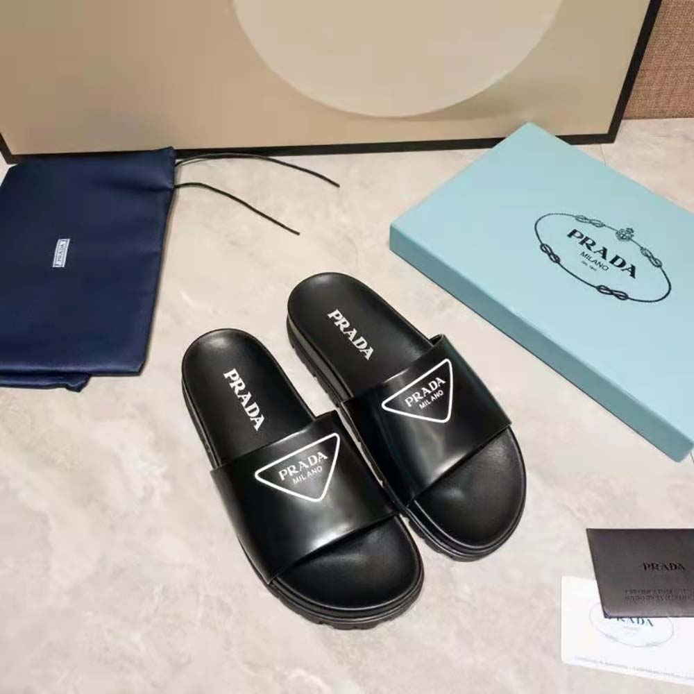Close-up on black leather and Prada logo embossing detail