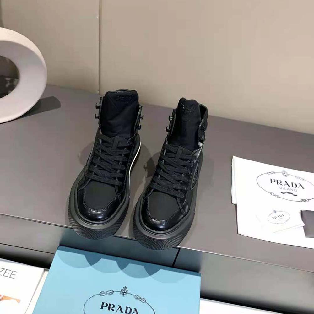 Close-up of brushed leather and Re-Nylon texture on Prada black high-tops